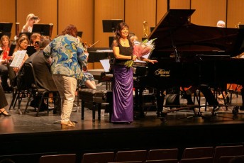 Pianist Catherine Wilson, soloist with Symphony on the Bay, performing with the orchestra with conductor Claudio Vena for the orchestra’s season finale at the Burlington Performing Arts Centre, Burlington, ON on Sunday, May 13, 2018.  SOTB President Gerry Callaghan presenting flowers to Catherine.  Photo by Marion Voysey