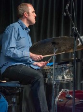 Ensemble Vivant Live in Concert Tribute to Rick Wilkins: Music at Fieldcote on Sunday, August 11, 2019.  Nick Fraser, drums (B&W) 
 Photo by Linda Schettle